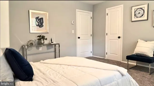 a view of empty room with window and ceiling fan
