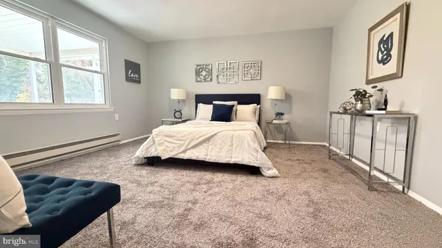 a bedroom with a bed and furniture