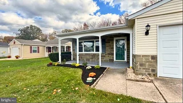 a view of a house with backyard sitting area and porch
