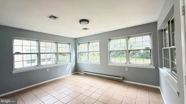 an empty room with windows