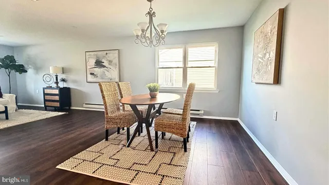 a kitchen with stainless steel appliances granite countertop white cabinets a sink and a stove