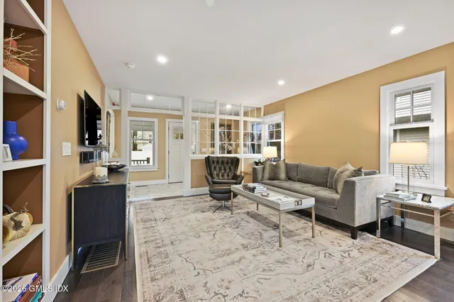 a living room with furniture window and a table