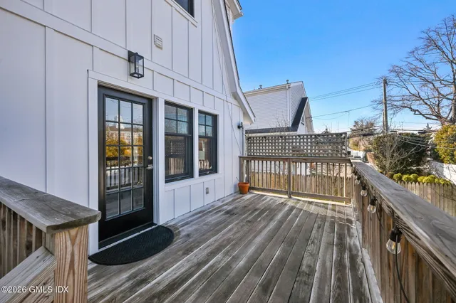 a view of a balcony with wooden floor