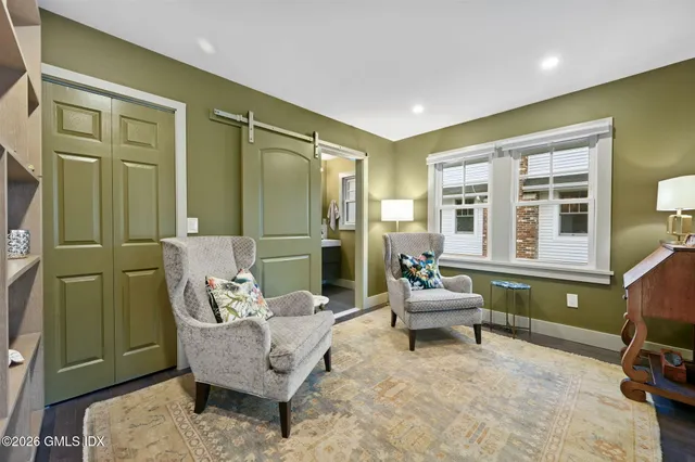 a living room with furniture and entry gate