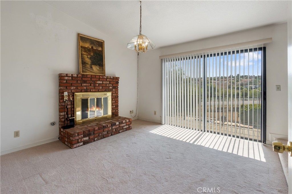 17656 Mockingbird Hill Circle Riverside, CA 92504 - Photo 17 of 49 a living room with furniture and a fireplace
