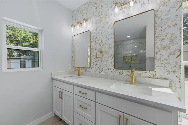 a bathroom with a sink and a mirror