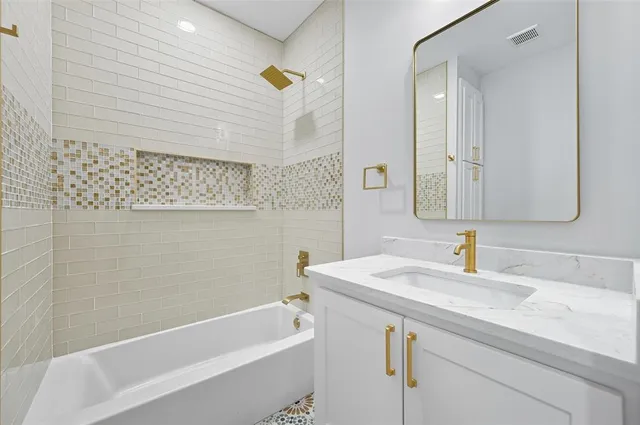 a bathroom with a sink and a bathtub