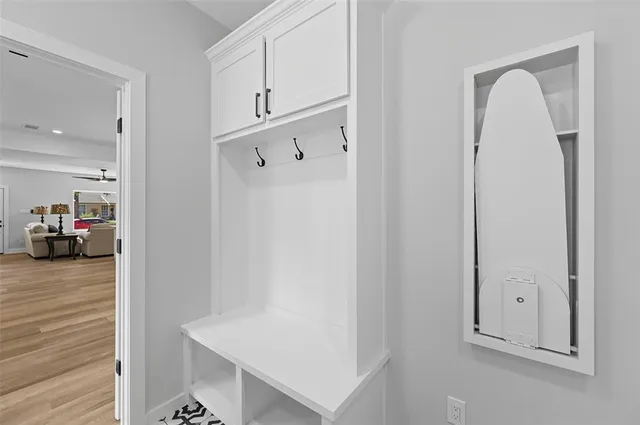 a view of hallway with livingroom and furniture
