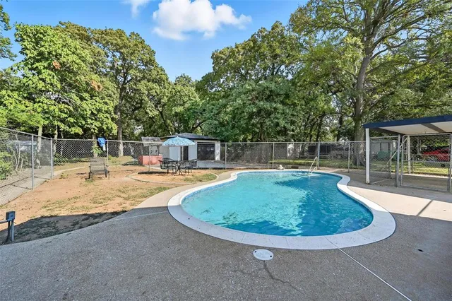a view of a swimming pool with a patio