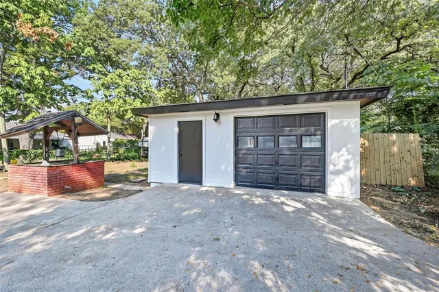 a view of a house with a yard and garage
