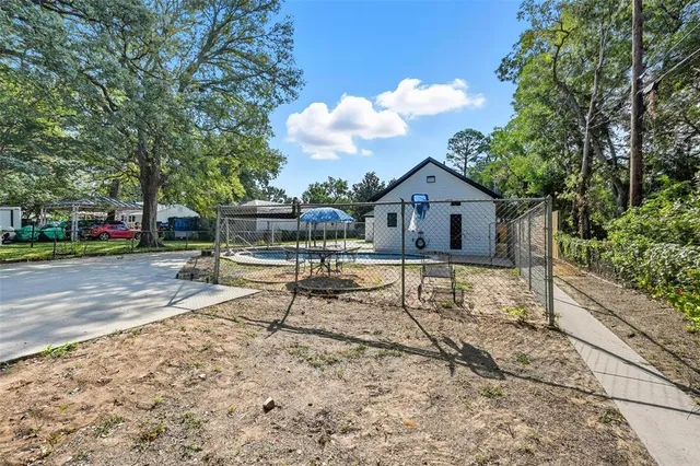 a house view with a sitting space and garden space