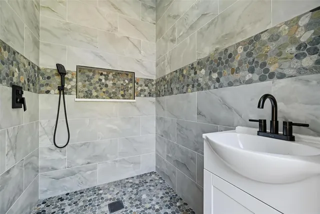 a bathroom with a sink and a shower