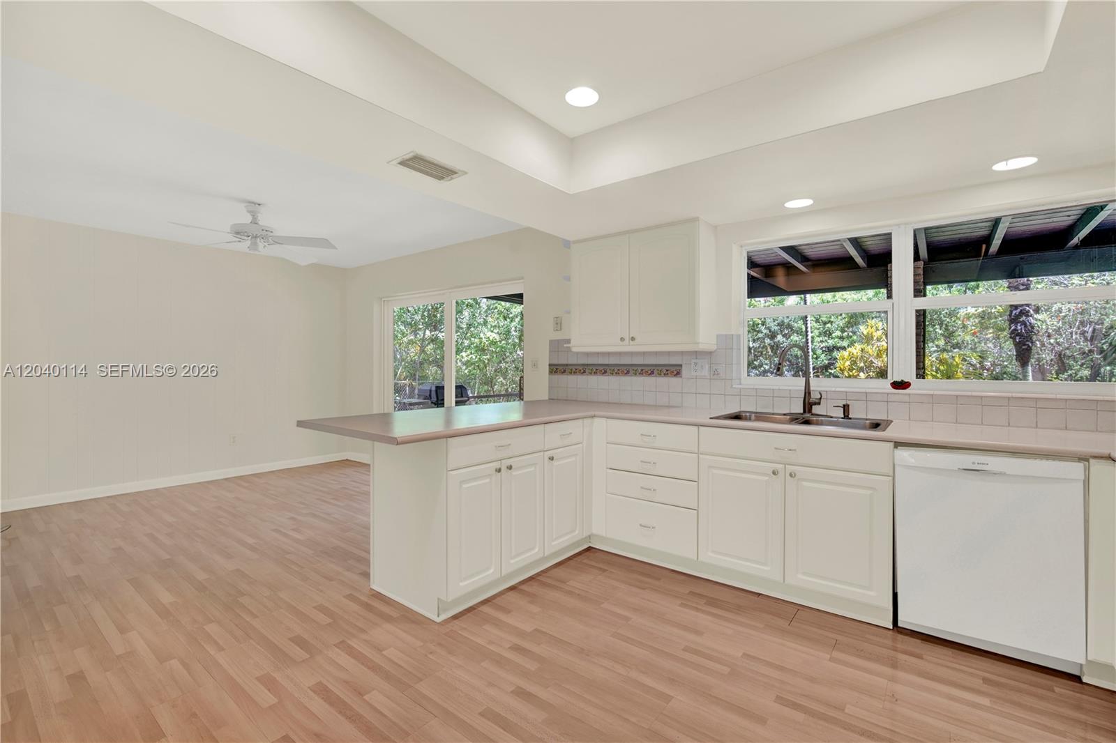10435 Southwest 96th Street Miami, FL 33176 - Photo 13 of 44 Kitchen opens to the family room with patio and backyard access
