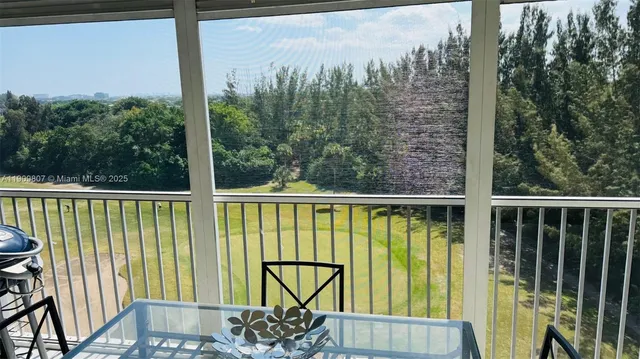 a view of a balcony with furniture
