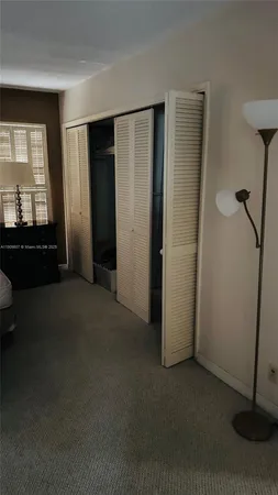 a view of empty room with windows
