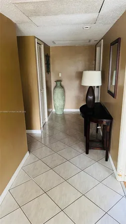 a view of a hallway with seating area