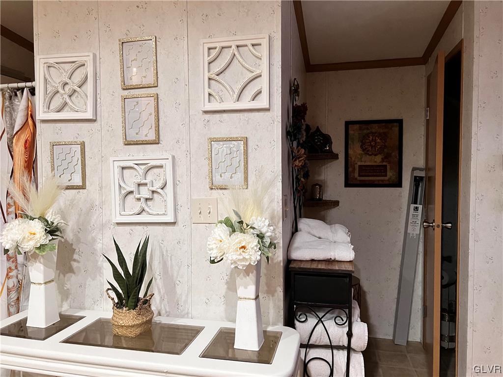 4205 Leopard Circle Orefield, PA 18069 - Photo 15 of 20 a table with a vase and flowers on it with table and chair