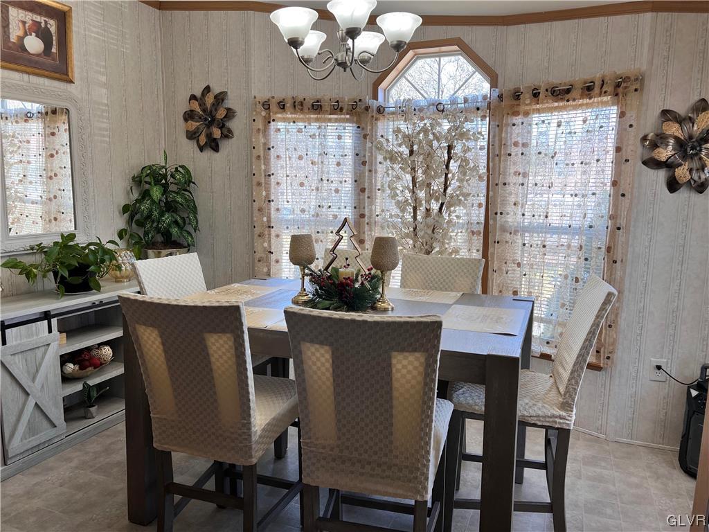4205 Leopard Circle Orefield, PA 18069 - Photo 8 of 20 a dining room with furniture potted plants and wooden floor