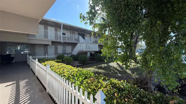 a view of a backyard with pathway