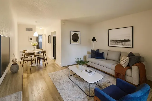 a living room with furniture and a table
