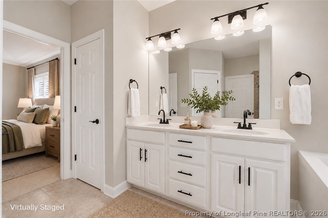 16 Ridge Road Jackson Springs, NC 27281 - Photo 11 of 50 a bathroom with a double vanity sink mirror and shower