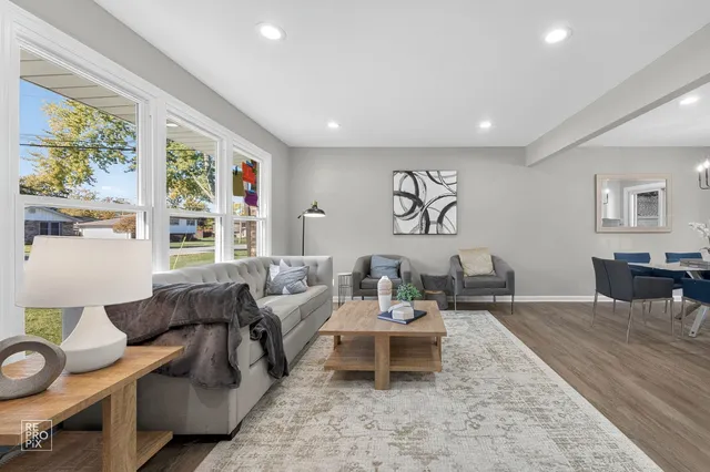 a living room with furniture and a table