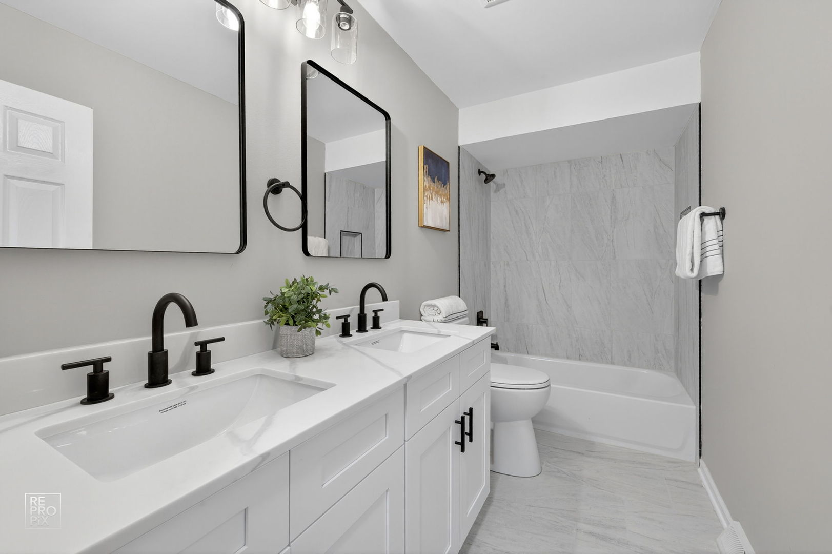15021 Kenton Avenue Midlothian, IL 60445 - Photo 7 of 10 a bathroom with a double vanity sink mirror and toilet