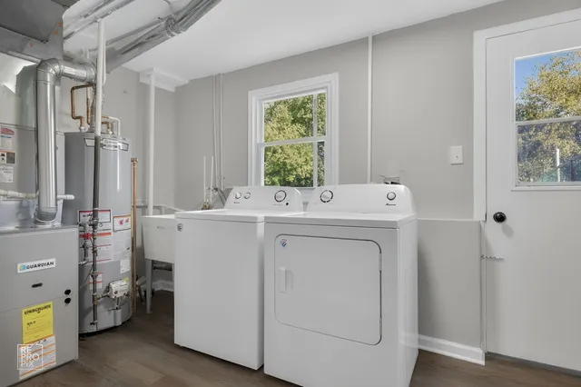 a utility room with closet dryer and washer