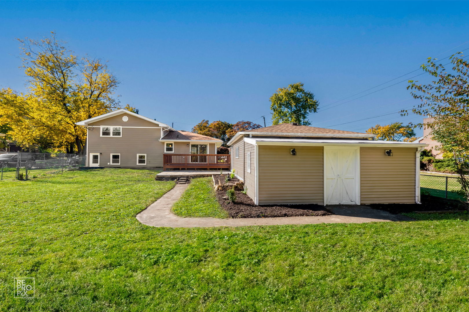 15021 Kenton Avenue Midlothian, IL 60445 - Photo 10 of 10 a front view of a house with a garden