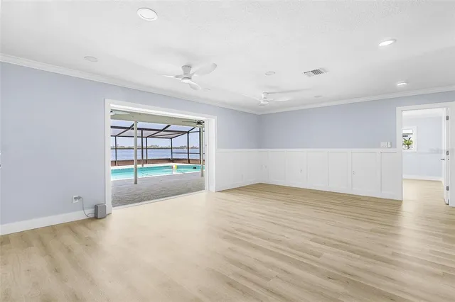 a view of an empty room with a window