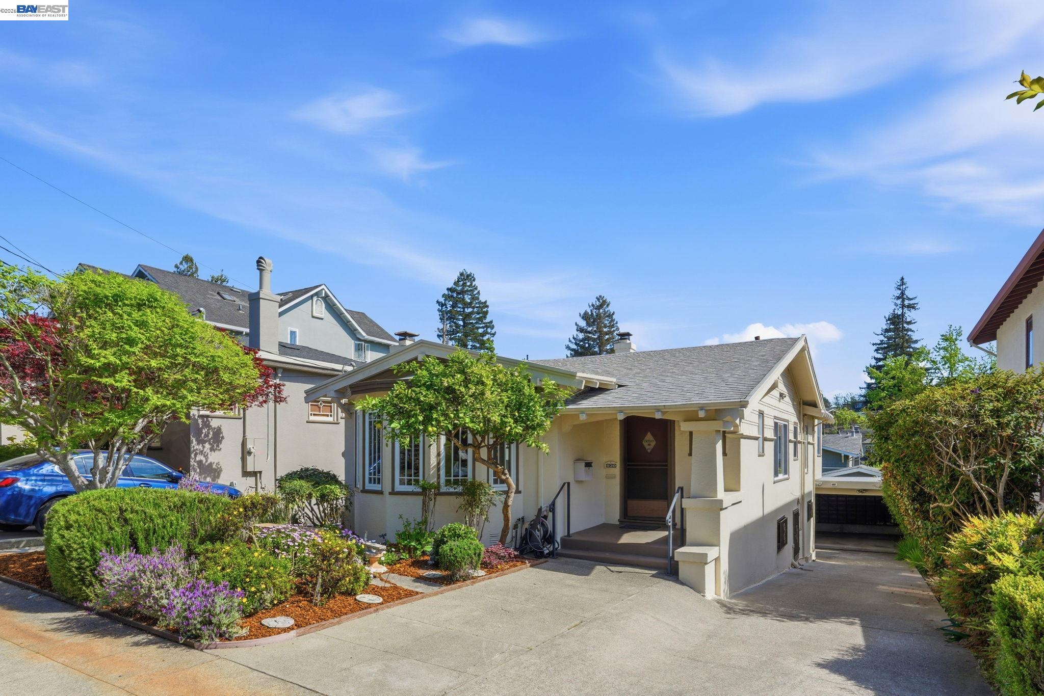 1130 Ranleigh Way Piedmont, CA 94610 - Photo 1 of 1 a front view of a house with garden