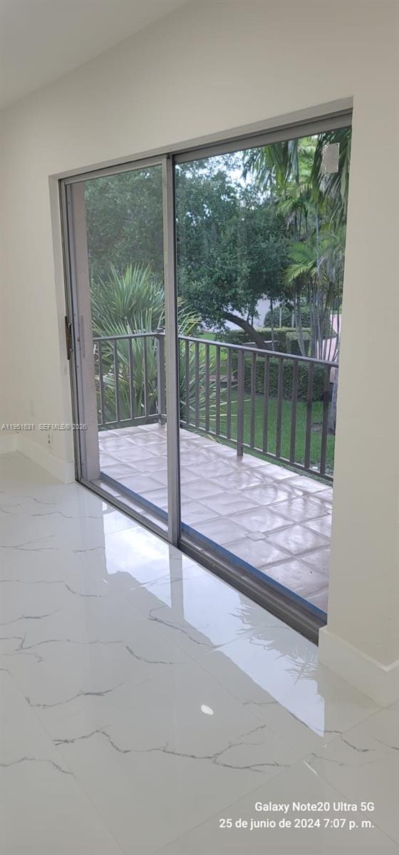 9402 Southwest 77th Avenue, Unit L8 Miami, FL 33156 - Photo 13 of 54 a view of a lake from a window