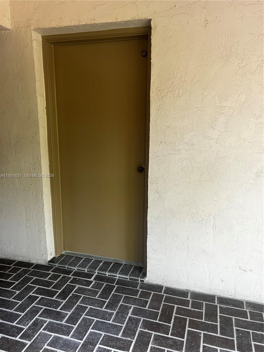 9402 Southwest 77th Avenue, Unit L8 Miami, FL 33156 - Photo 7 of 54 a view of a door