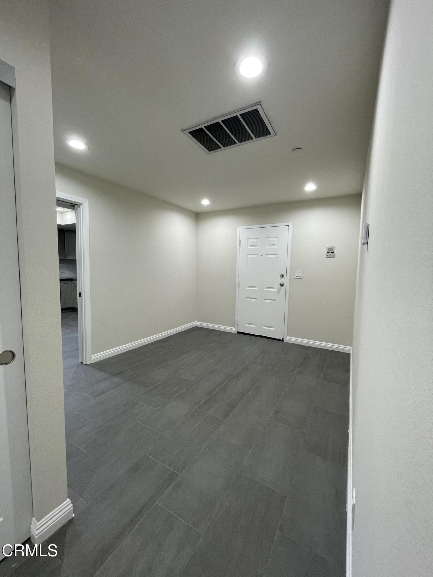 838 Fairview Avenue, Unit N Arcadia, CA 91007 - Photo 3 of 14 an empty room with windows and refrigerator