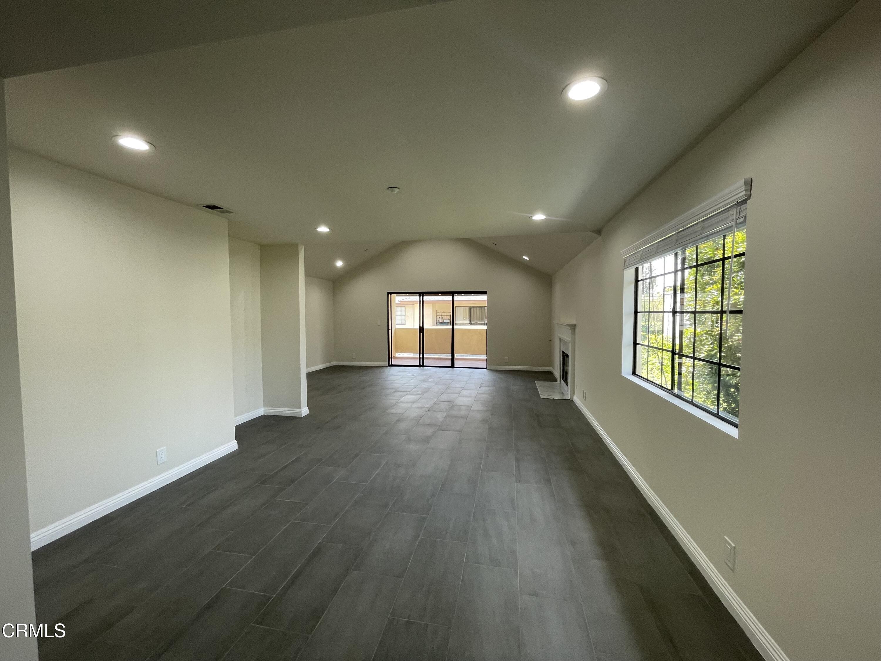 838 Fairview Avenue, Unit N Arcadia, CA 91007 - Photo 5 of 14 an empty room with wooden floor and windows