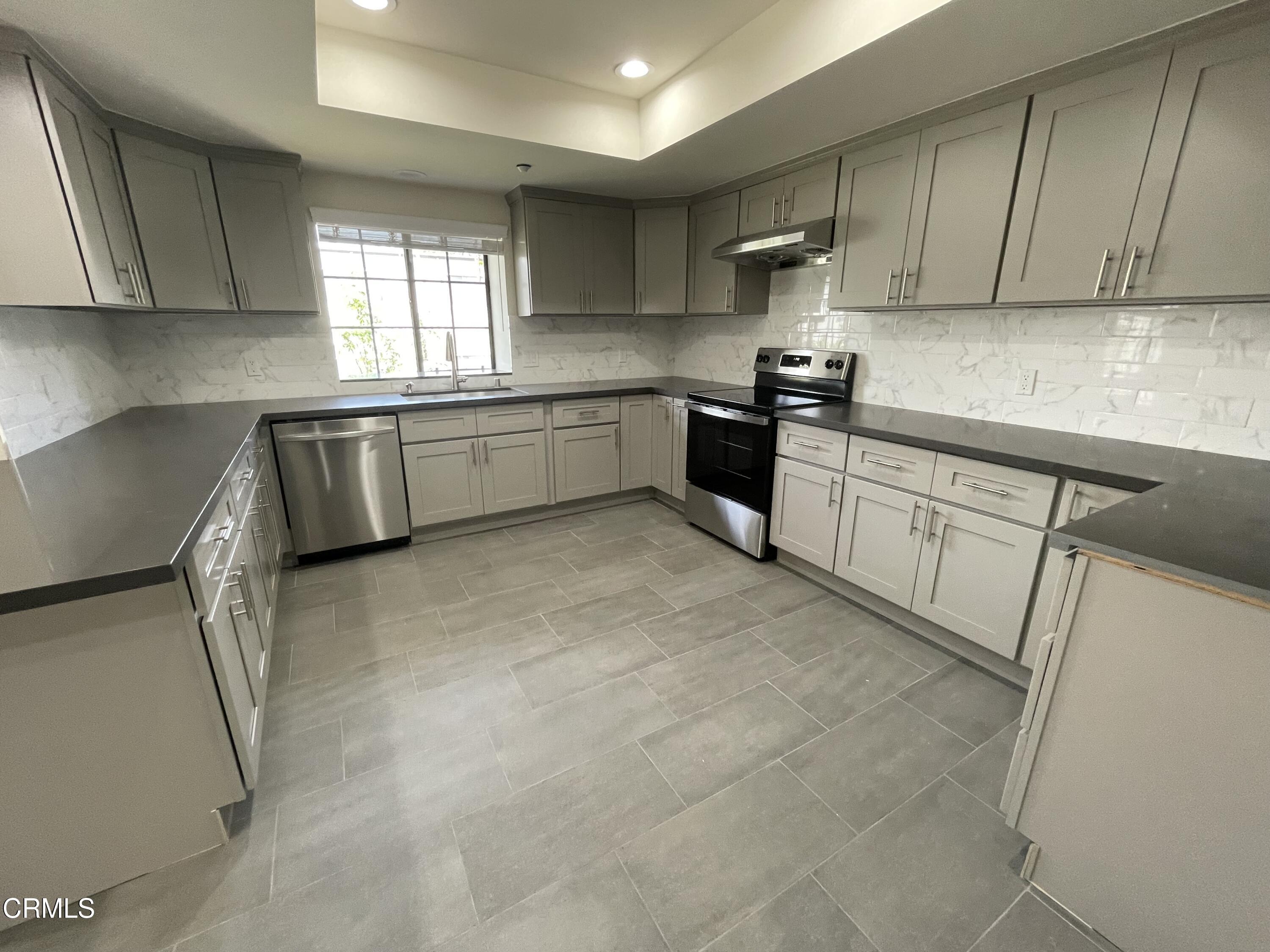 838 Fairview Avenue, Unit N Arcadia, CA 91007 - Photo 7 of 14 a kitchen with a sink window and cabinets