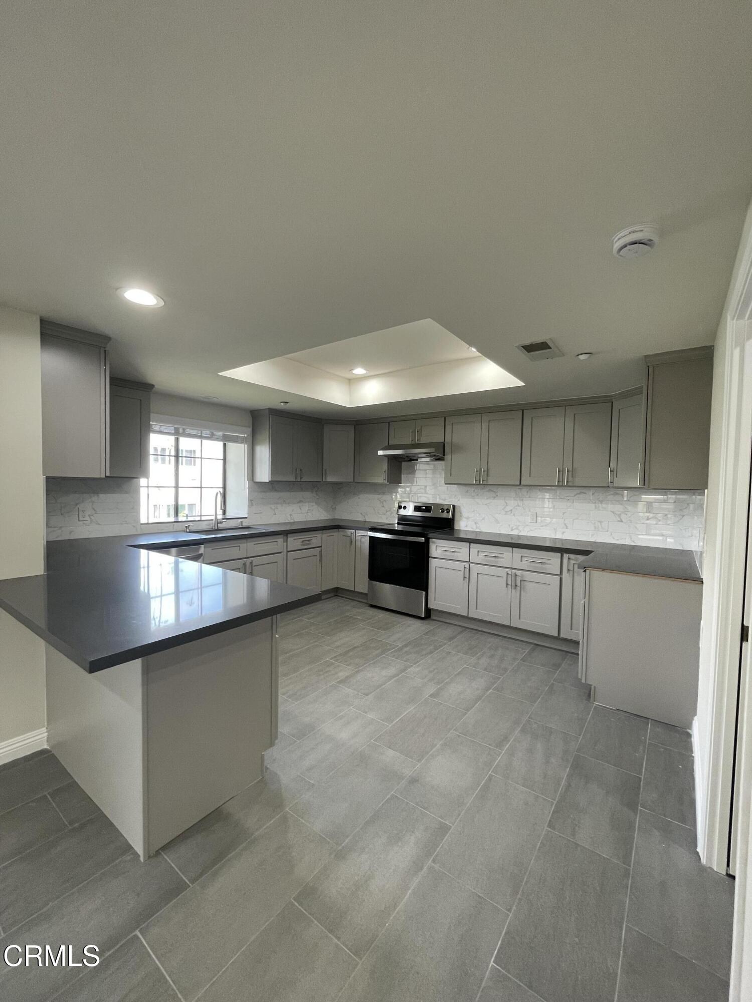 838 Fairview Avenue, Unit N Arcadia, CA 91007 - Photo 8 of 14 a kitchen with stainless steel appliances granite countertop a sink and cabinets