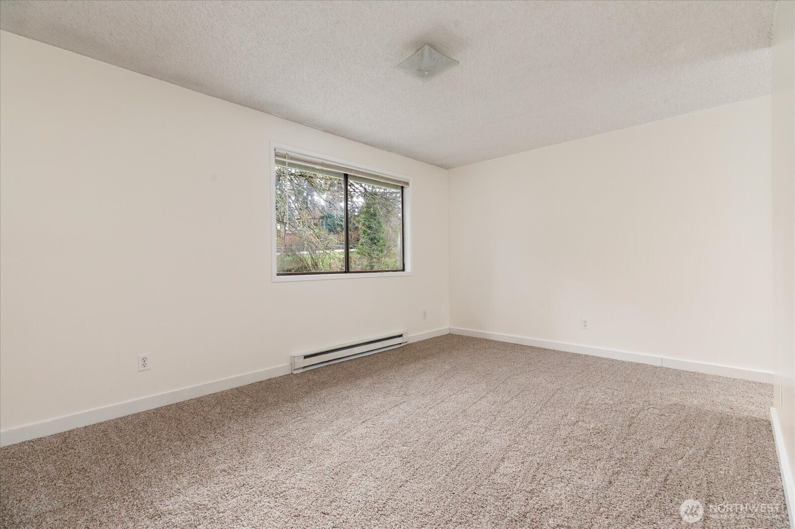 1282 Northwest Lanyard Loop, Unit 2 Oak Harbor, WA 98277 - Photo 13 of 32 an empty room with windows