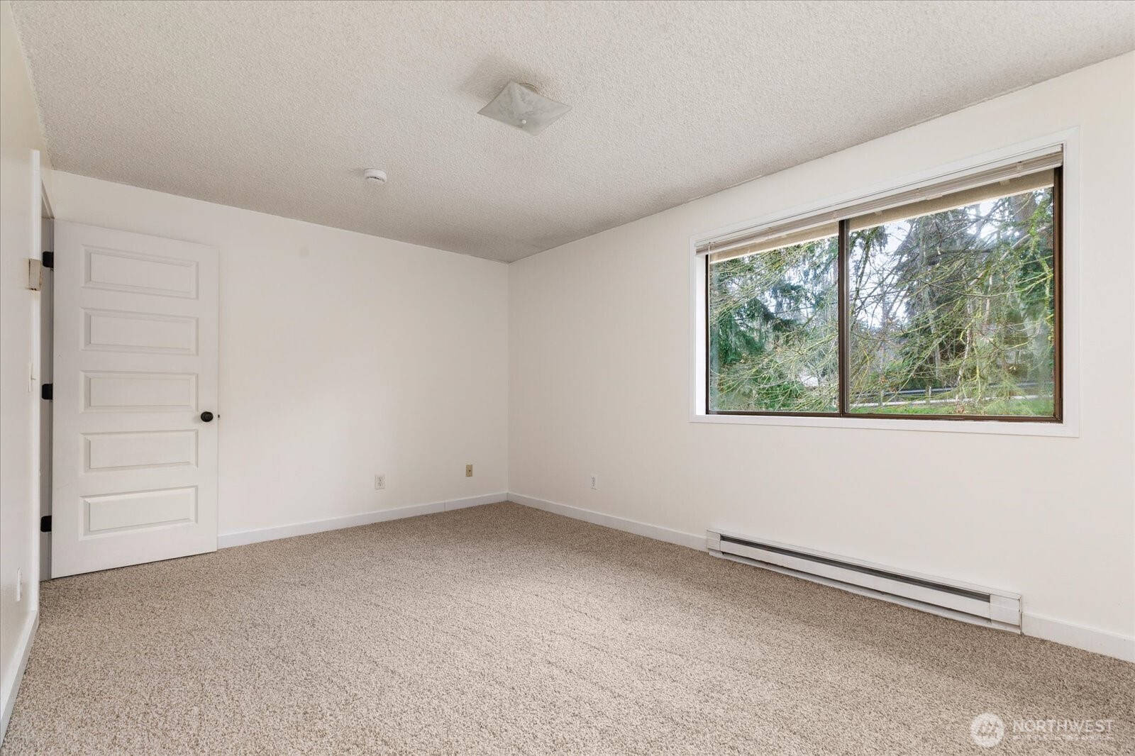 1282 Northwest Lanyard Loop, Unit 2 Oak Harbor, WA 98277 - Photo 15 of 32 an empty room with a window