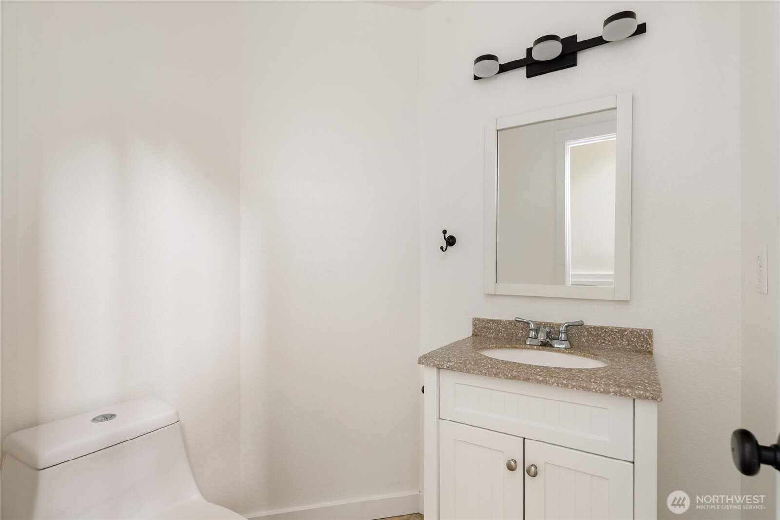 1282 Northwest Lanyard Loop, Unit 2 Oak Harbor, WA 98277 - Photo 24 of 32 a bathroom with a sink a toilet and shower