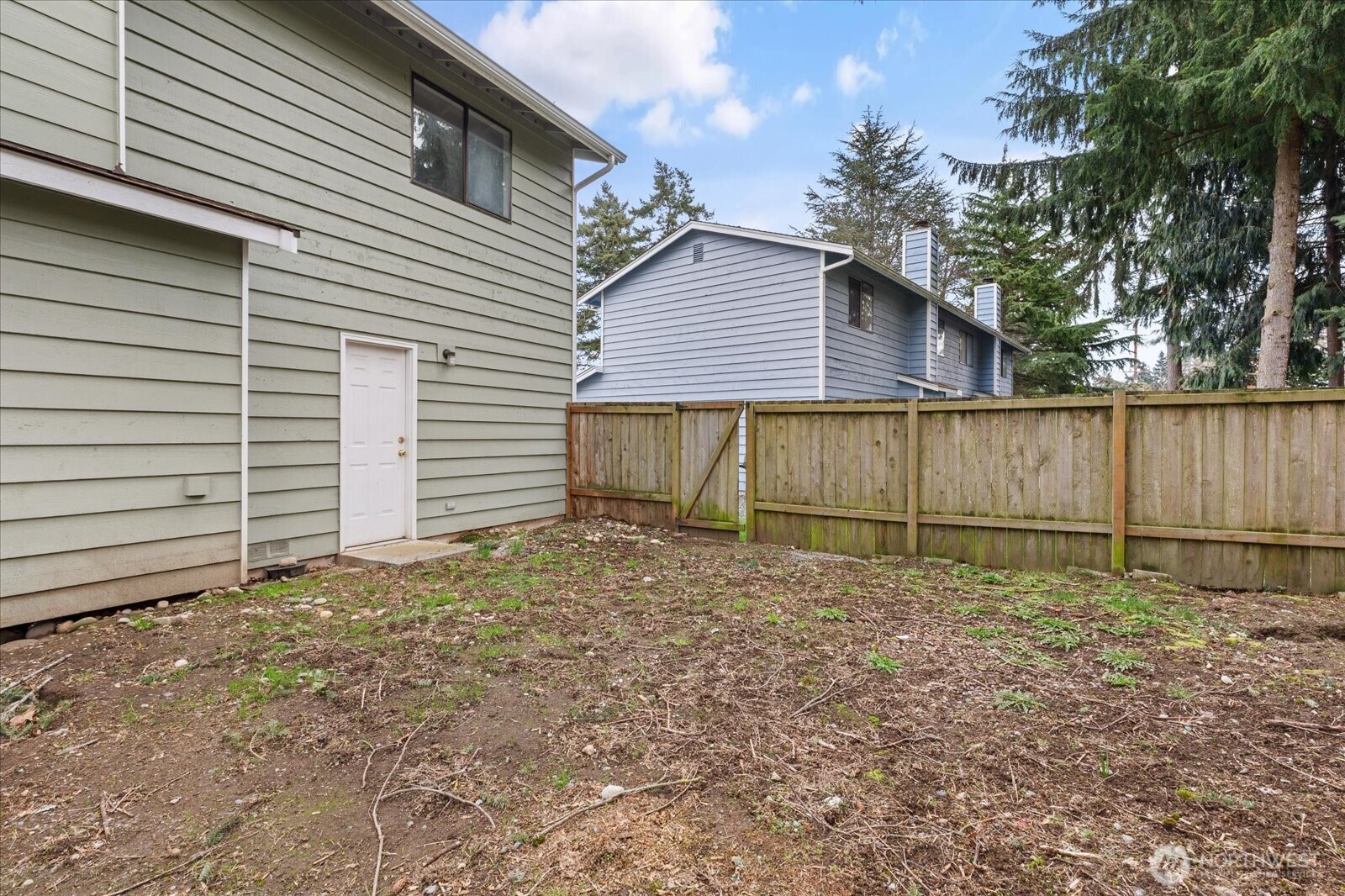 1282 Northwest Lanyard Loop, Unit 2 Oak Harbor, WA 98277 - Photo 26 of 32 a view of a backyard
