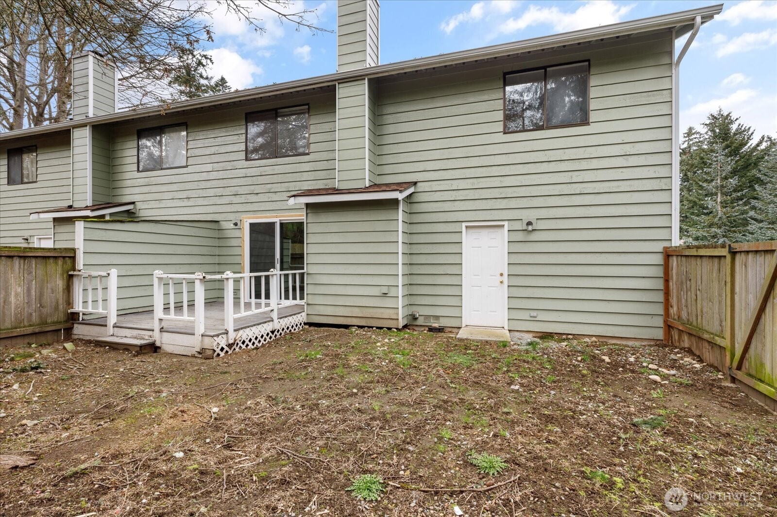 1282 Northwest Lanyard Loop, Unit 2 Oak Harbor, WA 98277 - Photo 27 of 32 a view of a house with a yard