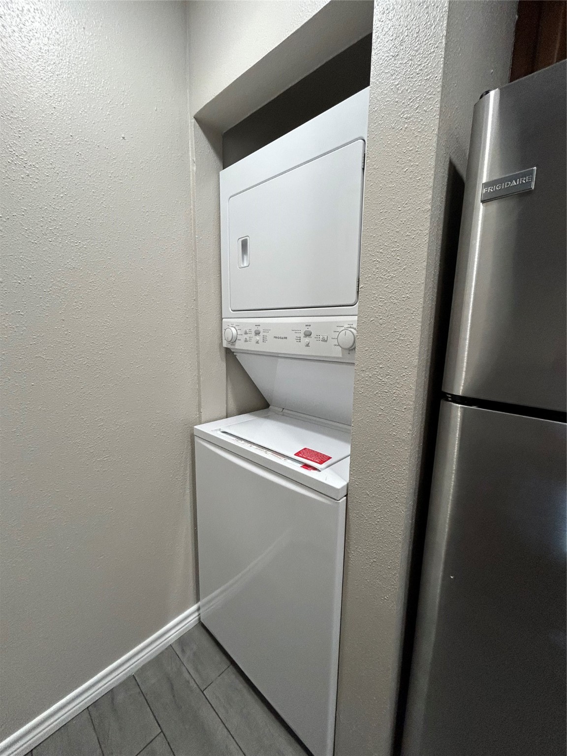 3300 Pebblebrook Drive, Unit 82 Seabrook, TX 77586 - Photo 8 of 13 a utility room with dryer and washer