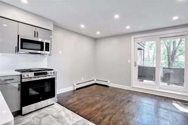 a kitchen with a stove and a microwave