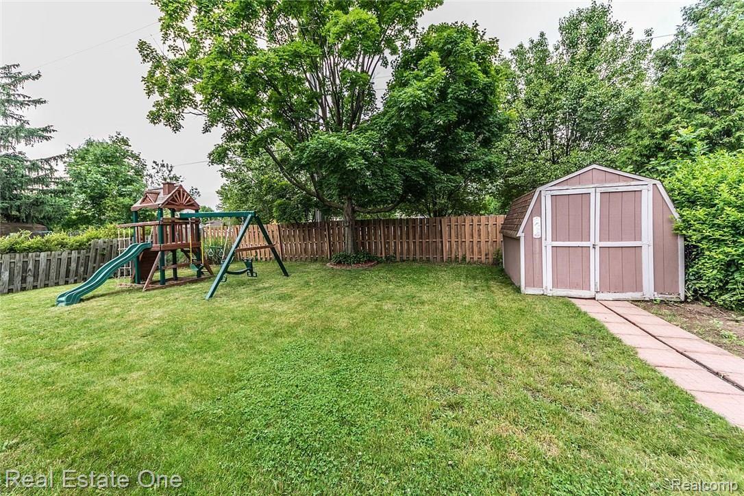 6127 Wedgewood Road Canton, MI 48187 - Photo 32 of 37 Backyard with shed. Playset is not included.