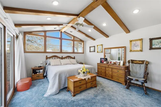 a bedroom with furniture and a window