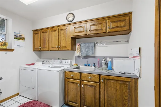 a kitchen with stainless steel appliances granite countertop a sink and cabinets
