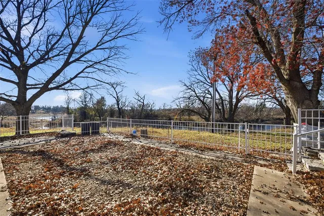 a lake view with large trees
