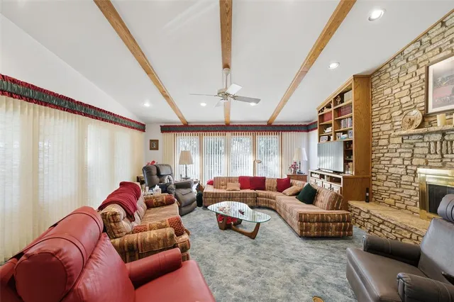 a living room with furniture or couch and a large window