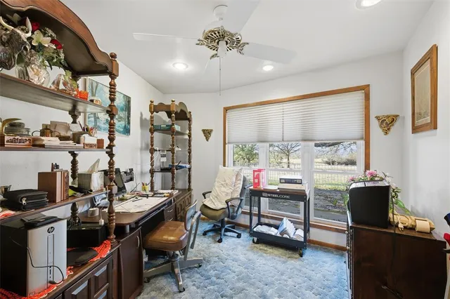 a view of a workspace with furniture